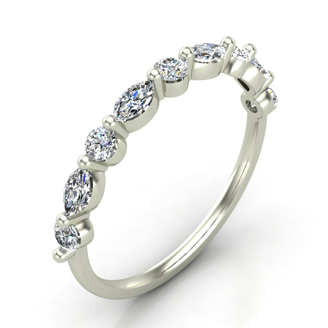 A  white gold diamond band ring featuring a row of marquise-cut and round brilliant-cut diamonds set in a prong setting, shown on a clean white background.